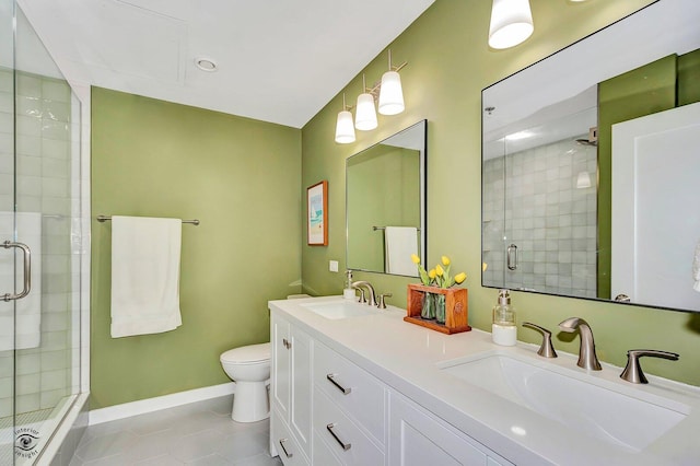 1645 W Ogden Ave Unit 722, Chicago, IL 60612 - bathroom featuring a stall shower, toilet, tile patterned floors, double vanity, and baseboards