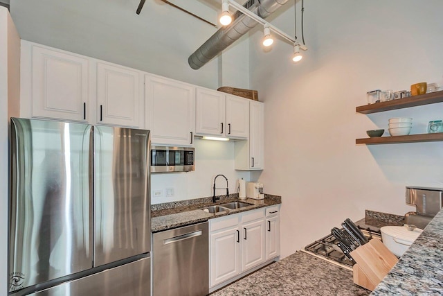 1645 W Ogden Ave Unit 722, Chicago, IL 60612 - kitchen featuring stainless steel appliances, a sink, white cabinetry, and dark stone countertops