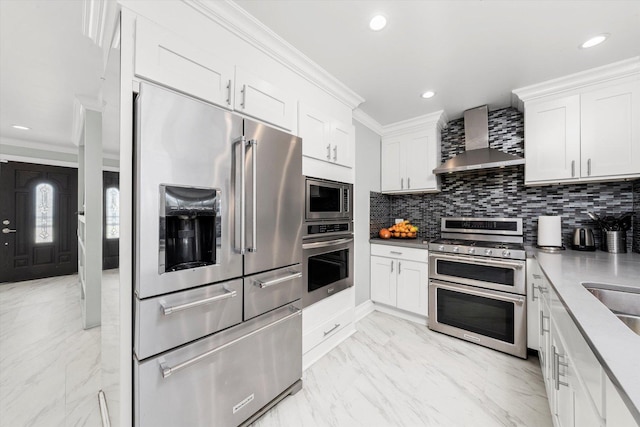 6315 W 83rd Pl, Burbank, IL 60459 - kitchen with stainless steel appliances, wall chimney range hood, ornamental molding, decorative backsplash, and white cabinets