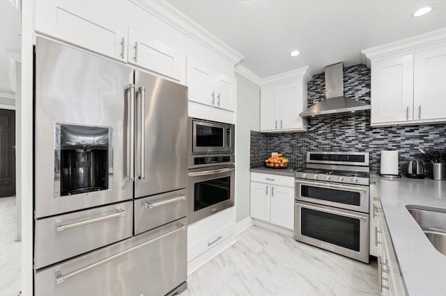 6315 W 83rd Pl, Burbank, IL 60459 - kitchen with appliances with stainless steel finishes, wall chimney exhaust hood, white cabinetry, ornamental molding, and backsplash