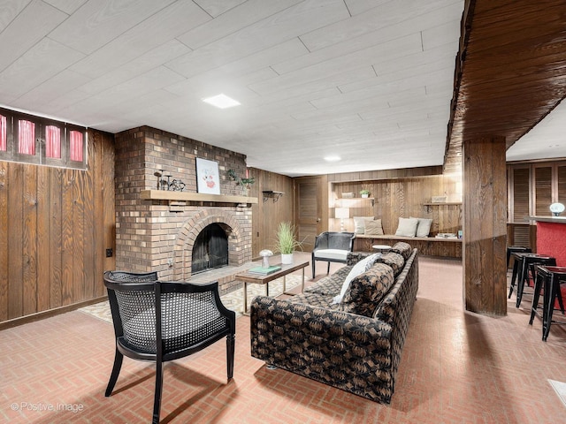 941 Meadowcrest Rd, La Grange Park, IL 60526 - living room with wooden walls, brick patterned floors, and a brick fireplace