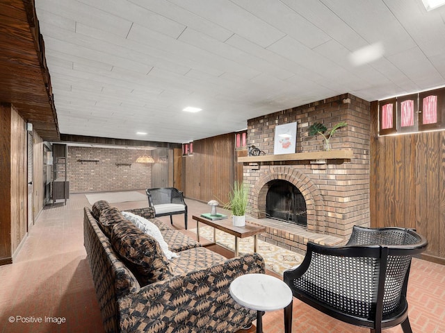 941 Meadowcrest Rd, La Grange Park, IL 60526 - living room featuring wood walls, a fireplace, brick wall, and wooden ceiling