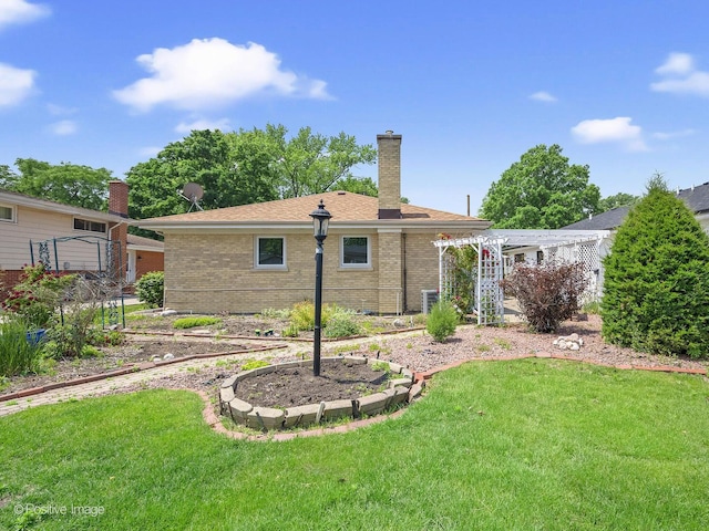 941 Meadowcrest Rd, La Grange Park, IL 60526 - back of house with brick siding, a lawn, and a chimney