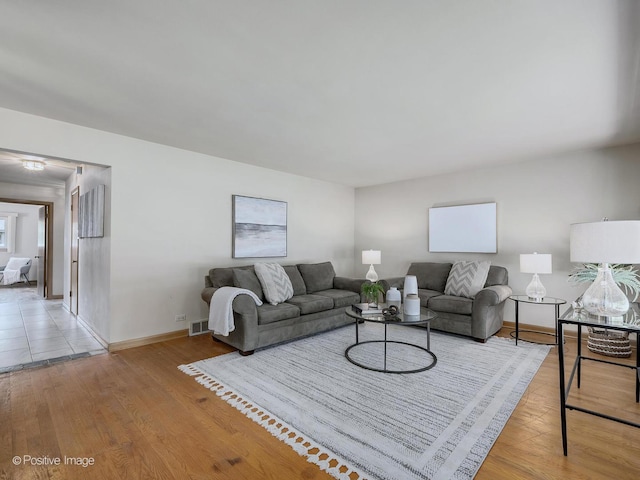 941 Meadowcrest Rd, La Grange Park, IL 60526 - living room featuring baseboards and light wood finished floors