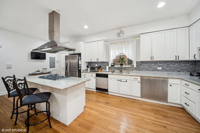 1055 E Hyde Park Blvd Unit 3, Chicago, IL 60615 - kitchen with island exhaust hood, stainless steel appliances, backsplash, a kitchen bar, and recessed lighting