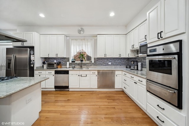 1055 E Hyde Park Blvd Unit 3, Chicago, IL 60615 - kitchen featuring stainless steel appliances, a warming drawer, a sink, white cabinetry, and recessed lighting