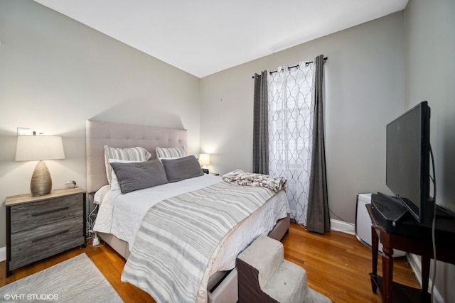 1055 E Hyde Park Blvd Unit 3, Chicago, IL 60615 - bedroom with wood finished floors and baseboards
