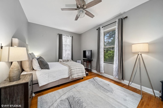 1055 E Hyde Park Blvd Unit 3, Chicago, IL 60615 - bedroom with baseboards, wood finished floors, and a ceiling fan