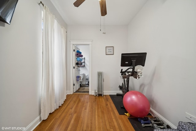 1055 E Hyde Park Blvd Unit 3, Chicago, IL 60615 - exercise room with radiator, wood finished floors, baseboards, and ceiling fan