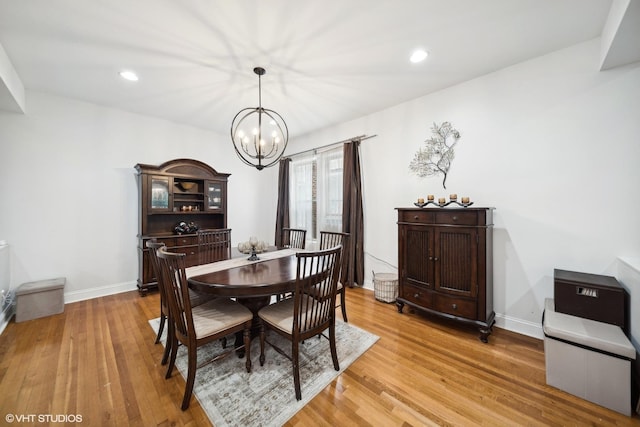 1055 E Hyde Park Blvd Unit 3, Chicago, IL 60615 - dining space with light wood-type flooring, a chandelier, recessed lighting, and baseboards
