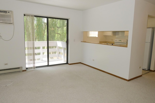 1367 N Winslowe Dr Unit 204, Palatine, IL 60074 - spare room featuring a baseboard radiator, light colored carpet, and baseboards