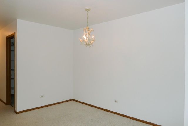 1367 N Winslowe Dr Unit 204, Palatine, IL 60074 - unfurnished room featuring light colored carpet, a chandelier, and baseboards