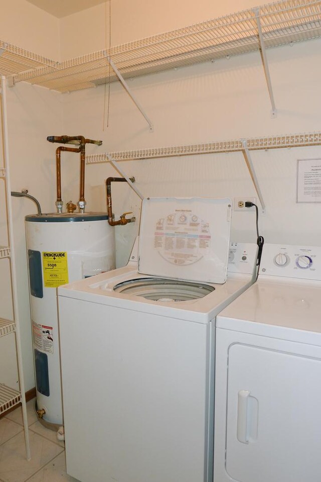 1367 N Winslowe Dr Unit 204, Palatine, IL 60074 - washroom with electric water heater, washer and dryer, and light tile patterned floors