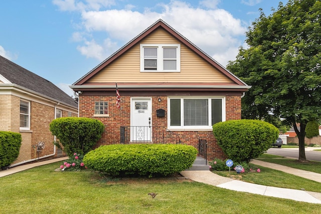 1946 N 75th Ct, Elmwood Park, IL 60707 - bungalow-style house with brick siding and a front lawn