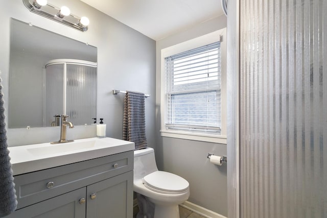 1946 N 75th Ct, Elmwood Park, IL 60707 - full bath featuring toilet, a shower with door, vanity, and baseboards