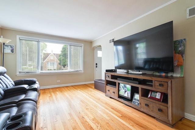 1946 N 75th Ct, Elmwood Park, IL 60707 - living room featuring crown molding, wood finished floors, arched walkways, and baseboards