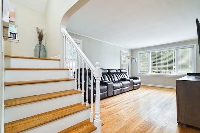 1946 N 75th Ct, Elmwood Park, IL 60707 - stairs with arched walkways, wood finished floors, and baseboards