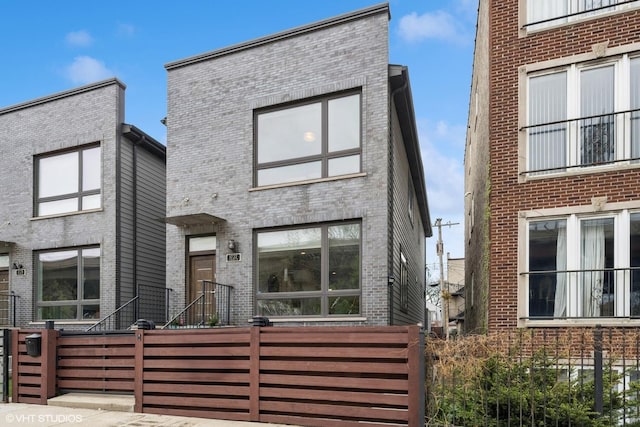 1727 S Ruble St, Chicago, IL 60616 - view of front of home with a fenced front yard and brick siding