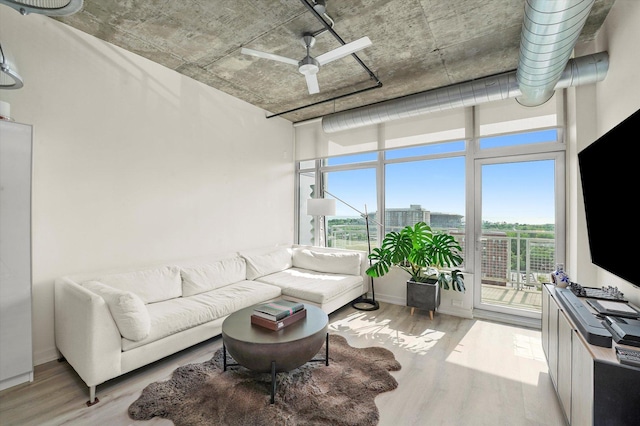 50 E 16th St Unit 1206, Chicago, IL 60616 - living area with healthy amount of natural light, wood finished floors, and a ceiling fan