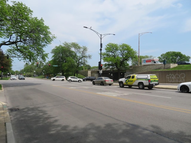 3950 N Lake Shore Dr Unit 1207B, Chicago, IL 60613 - view of asphalt road with traffic lights, sidewalks, curbs, and street lights