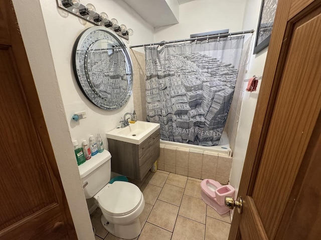 5016 S Prairie Ave Unit 1, Chicago, IL 60615 - bathroom with toilet, tile patterned flooring, tiled shower / bath combo, and vanity