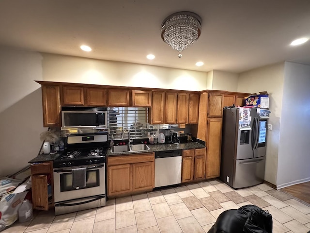 5016 S Prairie Ave Unit 1, Chicago, IL 60615 - kitchen featuring stainless steel appliances, a sink, brown cabinetry, recessed lighting, and tasteful backsplash