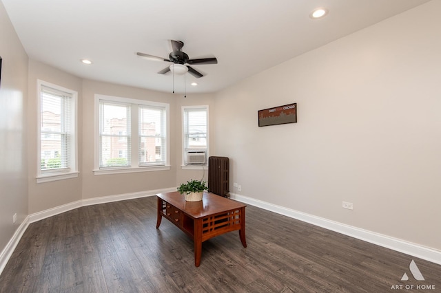 4855 W Roscoe St Unit 1, Chicago, IL 60641 - living area with radiator, dark wood finished floors, ceiling fan, and recessed lighting