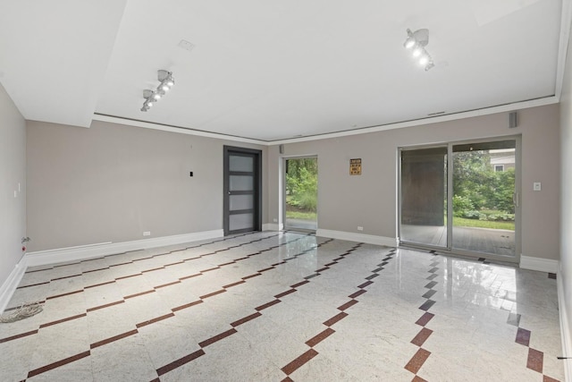 16W307 95th Pl, Burr Ridge, IL 60527 - empty room featuring inlaid floor details and baseboards
