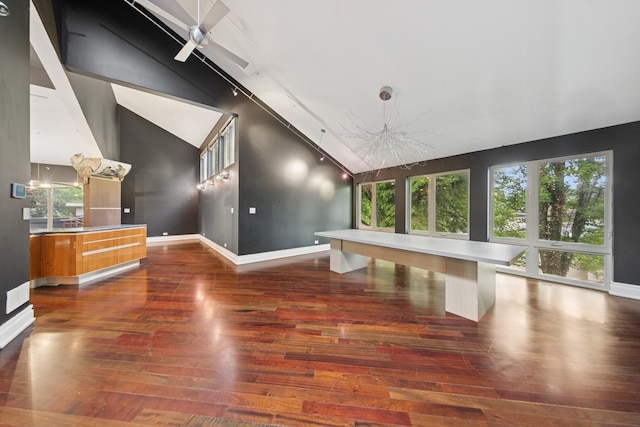 16W307 95th Pl, Burr Ridge, IL 60527 - unfurnished living room featuring dark wood-style floors, high vaulted ceiling, plenty of natural light, and ceiling fan