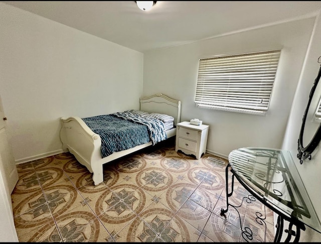 1330 Todd Farm Dr, Elgin, IL 60123 - tiled bedroom with baseboards