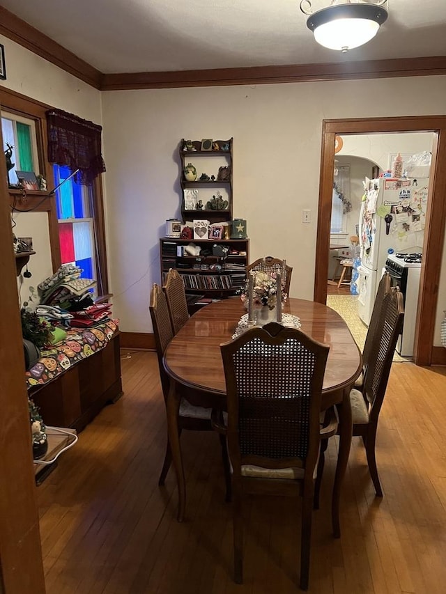 316 E Jefferson St, Freeport, IL 61032 - dining room featuring light wood finished floors and ornamental molding
