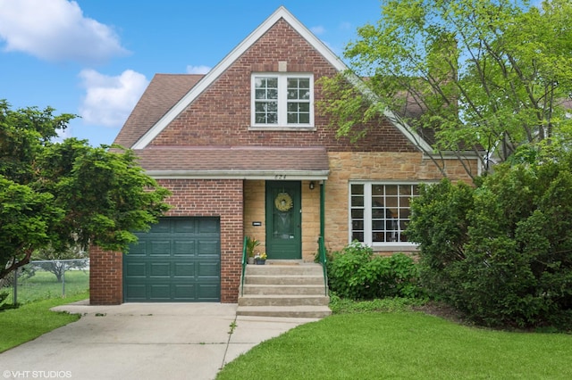 624 N Lombard Ave, Oak Park, IL 60302 - view of front of home featuring concrete driveway, a shingled roof, and brick siding
