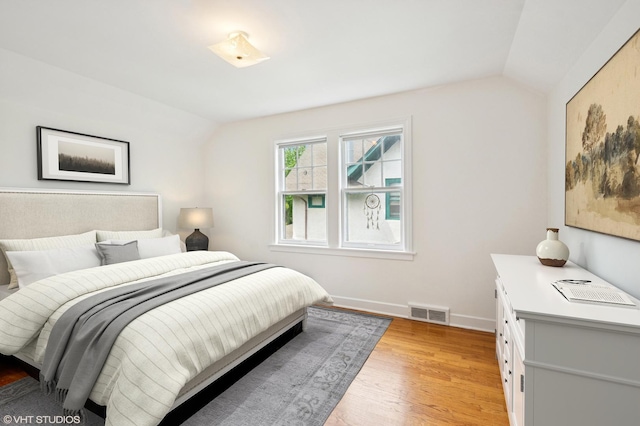 624 N Lombard Ave, Oak Park, IL 60302 - bedroom with lofted ceiling and light wood-style floors
