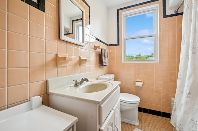 624 N Lombard Ave, Oak Park, IL 60302 - full bathroom with tile walls, vanity, curtained shower, and tile patterned floors
