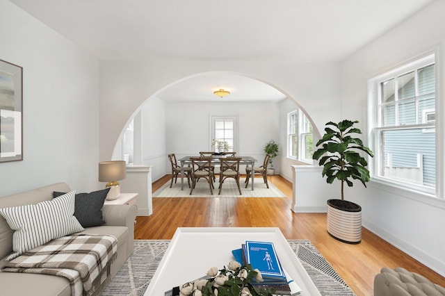 624 N Lombard Ave, Oak Park, IL 60302 - living area featuring arched walkways, radiator, and wood finished floors