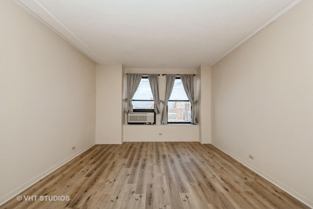 600 S Dearborn St Unit 1708, Chicago, IL 60605 - unfurnished room with light wood-style flooring and cooling unit