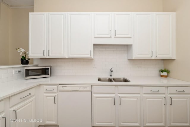 600 S Dearborn St Unit 1708, Chicago, IL 60605 - kitchen featuring white dishwasher, stainless steel microwave, white cabinetry, backsplash, and light countertops