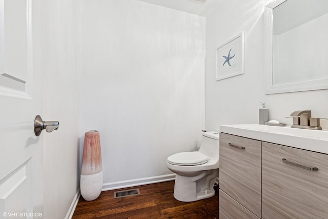 10596 W 154th Pl, Orland Park, IL 60462 - half bathroom with vanity, wood finished floors, toilet, and baseboards