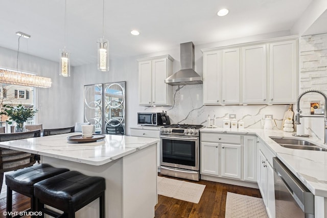 10596 W 154th Pl, Orland Park, IL 60462 - kitchen with wall chimney range hood, stainless steel appliances, a sink, a center island, and light stone countertops