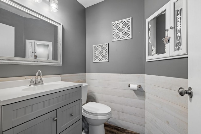 15910 W Ridge St, Lockport, IL 60441 - bathroom featuring toilet, vanity, wainscoting, and wood finished floors