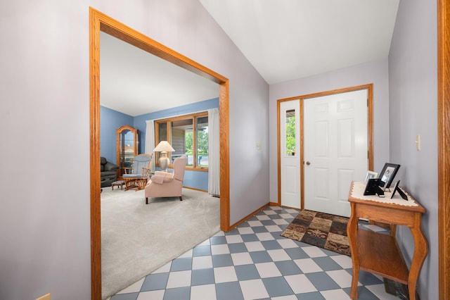 10 Primrose Ln, Sycamore, IL 60178 - entrance foyer featuring tile patterned floors, vaulted ceiling, baseboards, and carpet flooring