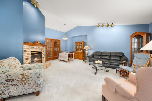 10 Primrose Ln, Sycamore, IL 60178 - living area featuring lofted ceiling, carpet floors, and a chandelier