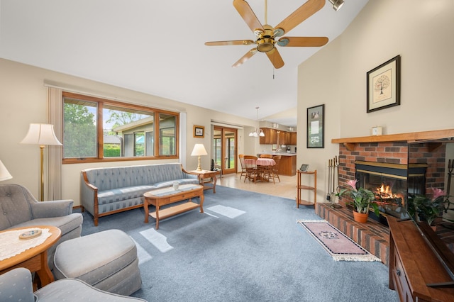 10 Primrose Ln, Sycamore, IL 60178 - living room with lofted ceiling, carpet floors, healthy amount of natural light, ceiling fan, and a fireplace