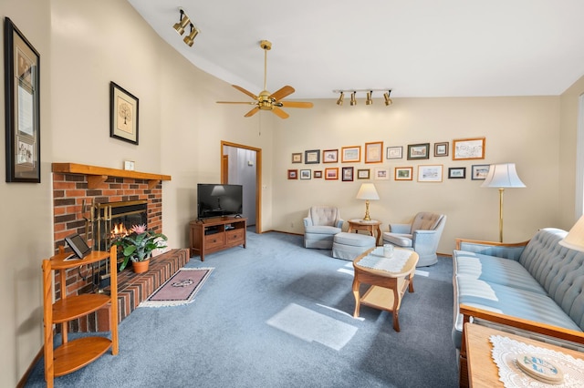 10 Primrose Ln, Sycamore, IL 60178 - living area featuring rail lighting, carpet floors, a ceiling fan, a fireplace, and lofted ceiling