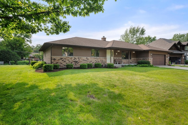 10 Primrose Ln, Sycamore, IL 60178 - view of front of house with an attached garage, a chimney, a front lawn, concrete driveway, and brick siding