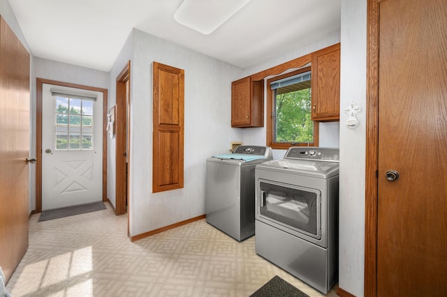 10 Primrose Ln, Sycamore, IL 60178 - laundry area with cabinet space, washer and clothes dryer, healthy amount of natural light, and baseboards