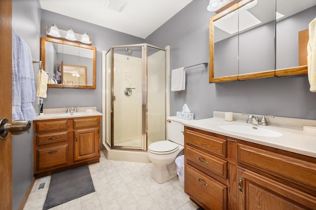 10 Primrose Ln, Sycamore, IL 60178 - full bath featuring a stall shower, two vanities, and toilet