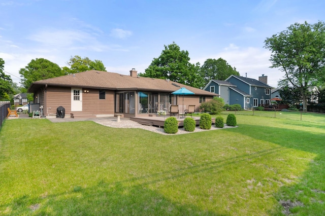 10 Primrose Ln, Sycamore, IL 60178 - rear view of property with a wooden deck and a chimney