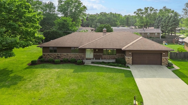 10 Primrose Ln, Sycamore, IL 60178 - view of front of property with a garage, concrete driveway, a chimney, and roof with shingles