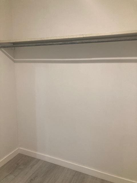 129 Elk Trl W Unit 329, Carol Stream, IL 60188 - walk in closet featuring wood finished floors